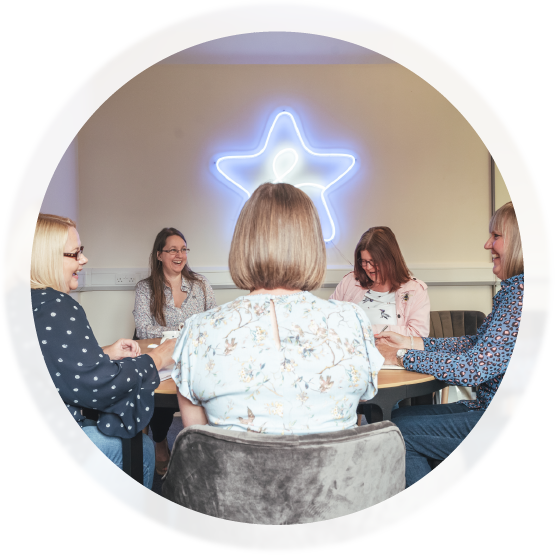 staff-in-team-meeting image of staff in a team meeting